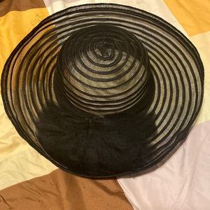 Black hat/ ruffles in the front